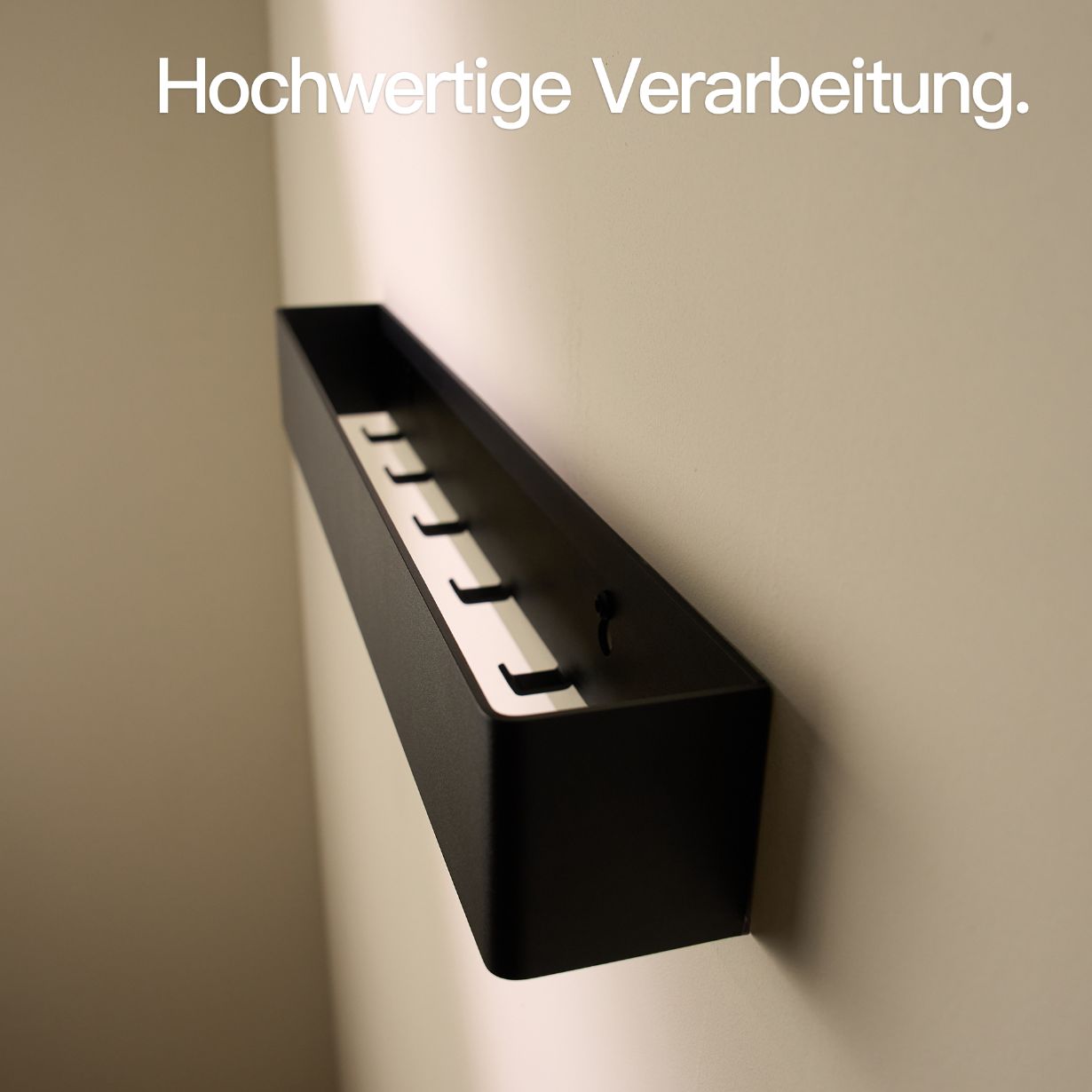 Designfabrik Hamburg Wandgarderobe mit versteckten Haken aus Metall schwarz